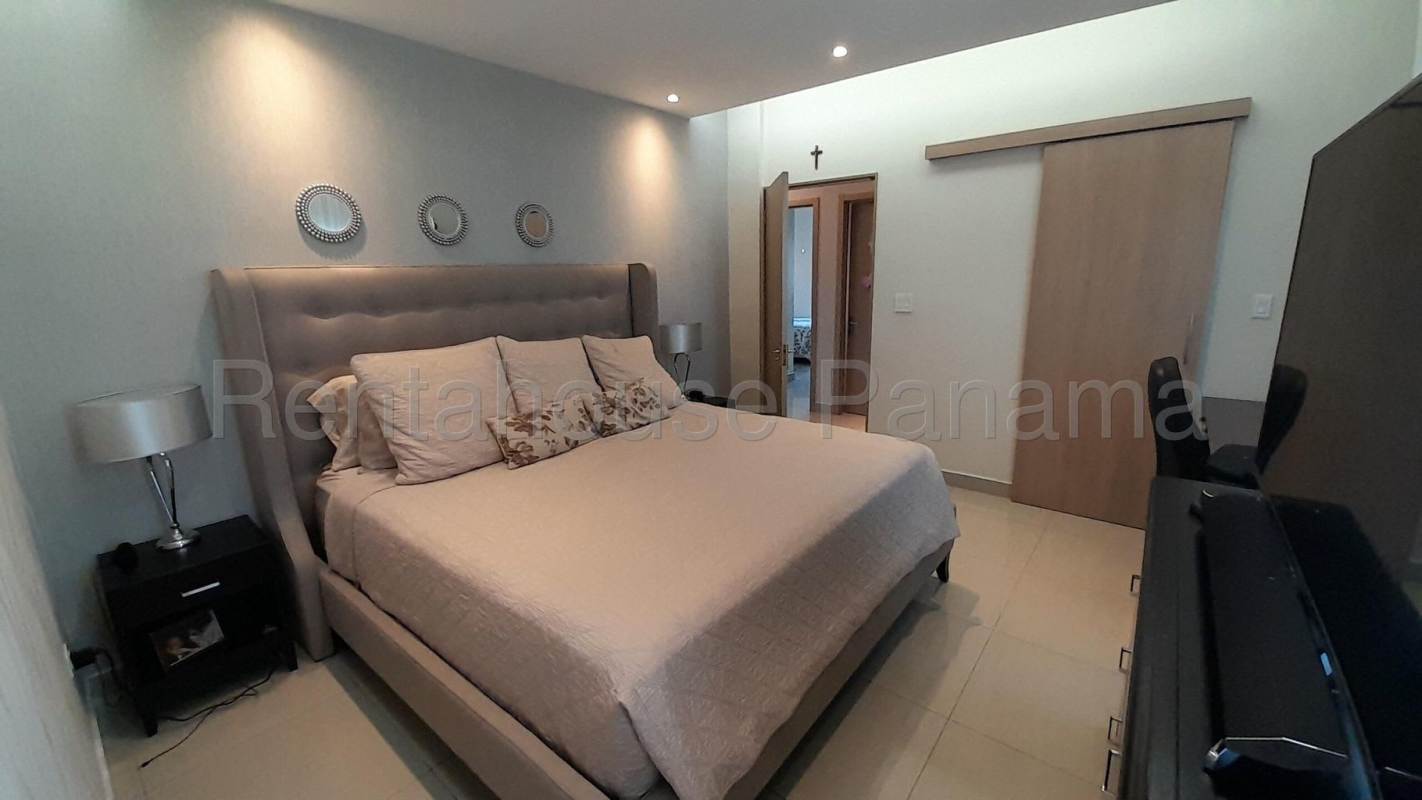 Modern dining room with panoramic window and skyline view in penthouse South Coast Tower Panama