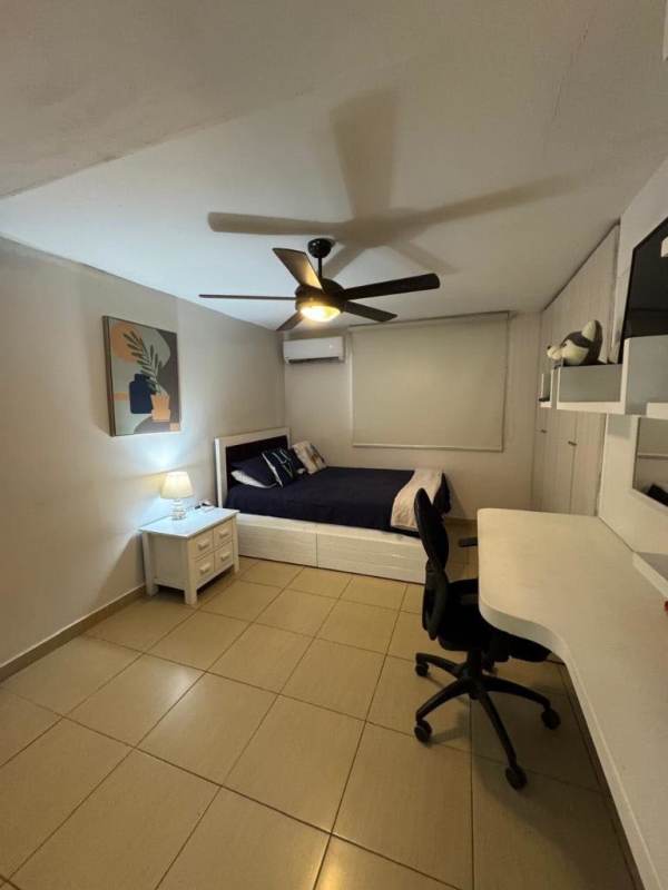 Large bedroom with closet and fan in Villa Cáceres near Tumba Muerto Panama City