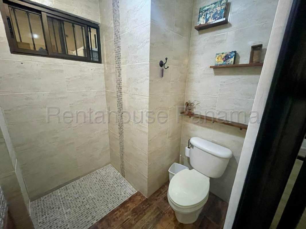 Large covered terrace in Villa de Las Fuentes house Panama with garden view