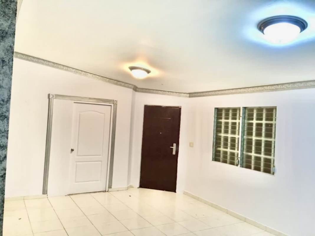 Bright tiled living and dining room in Las Cumbres house Panama