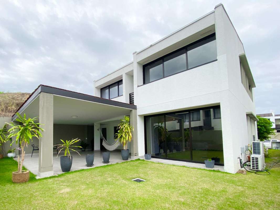Modern bright open concept living and dining room with large windows in Condado del Rey Panama