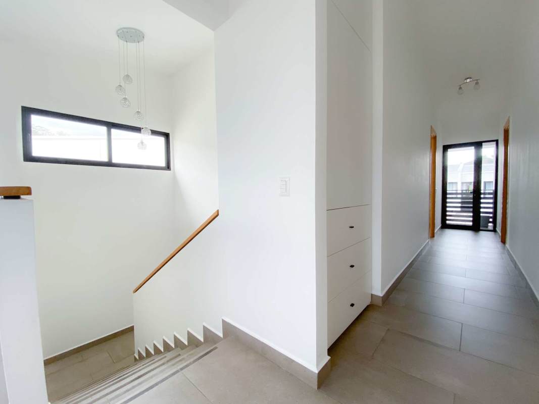 Bright bedroom with large windows in house for sale Barrio Alto Residences Panama