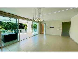 Modern living room with large sliding glass doors to balcony in Bijao Beach Panama