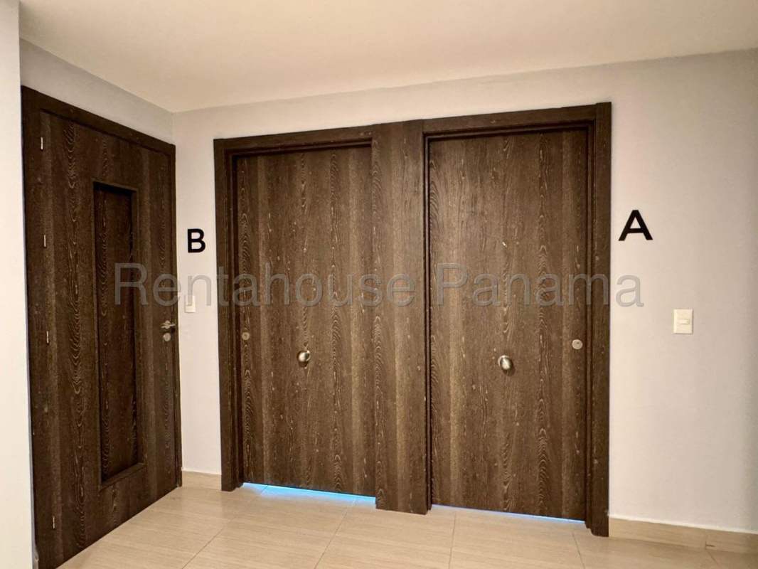 Interior corridor with wooden doors in PH Oceana apartment Costa del Este Panama City