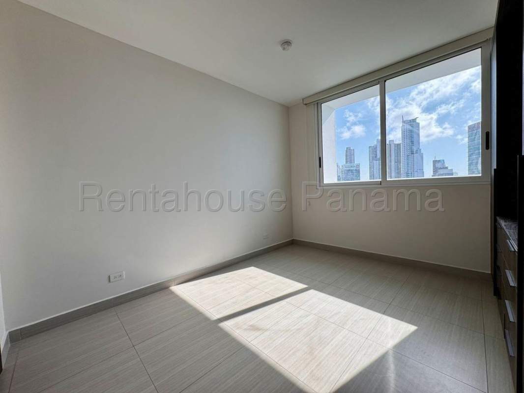 Bright bedroom large window city skyline view PH Oceana Costa del Este Panama