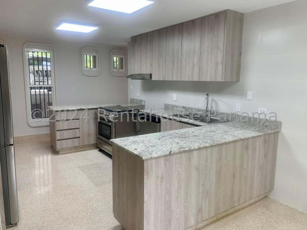 Formal dining room opening to covered terrace overlooking gardens in Altos del Golf luxury house Panama City
