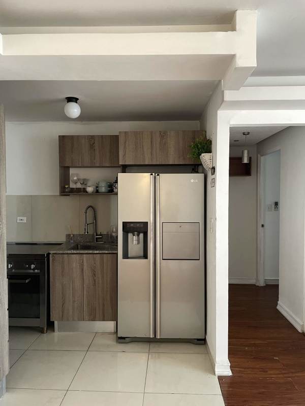 Modern kitchen with appliances and granite-look countertops in PH Torres de España Panama