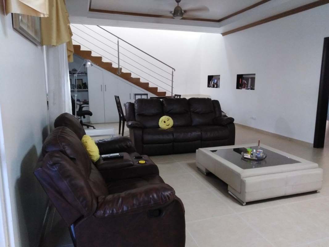 Kitchen with granite countertops, black cabinets and stainless steel appliances in Altos de Panamá Panama City