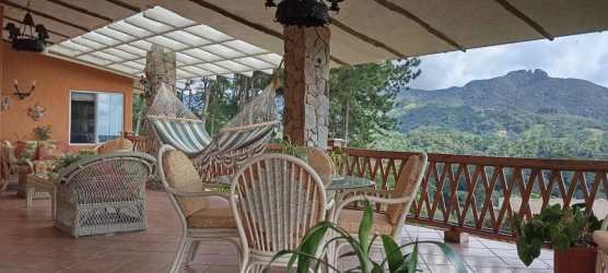 Spacious terrace with pergola, wicker furniture and mountain view in El Valle Panama