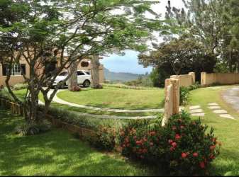 Cozy living room with fireplace and rustic accents in El Valle mountain estate Panama