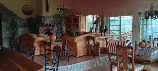 Rustic open plan living and dining room with panoramic views at El Valle, Panama