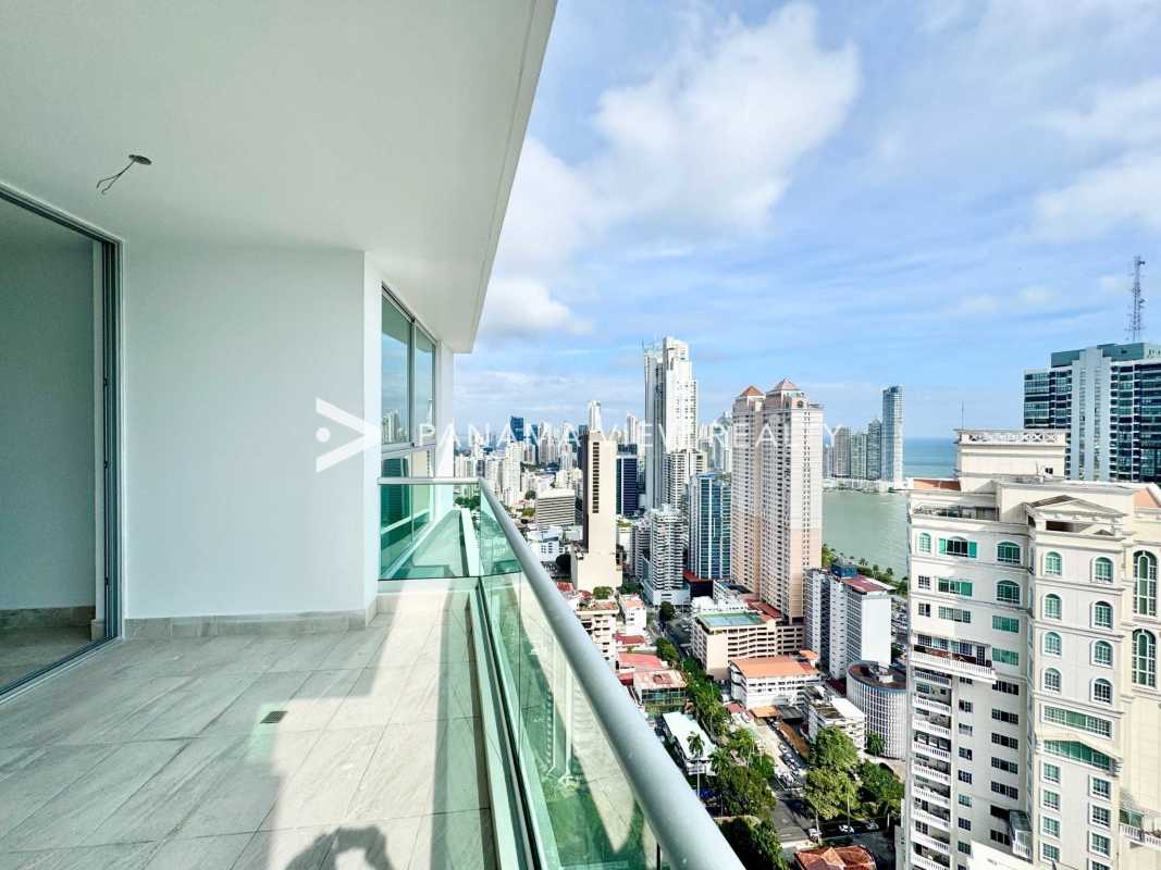 Bedroom with expansive glass windows offering panoramic views PH Costanera
