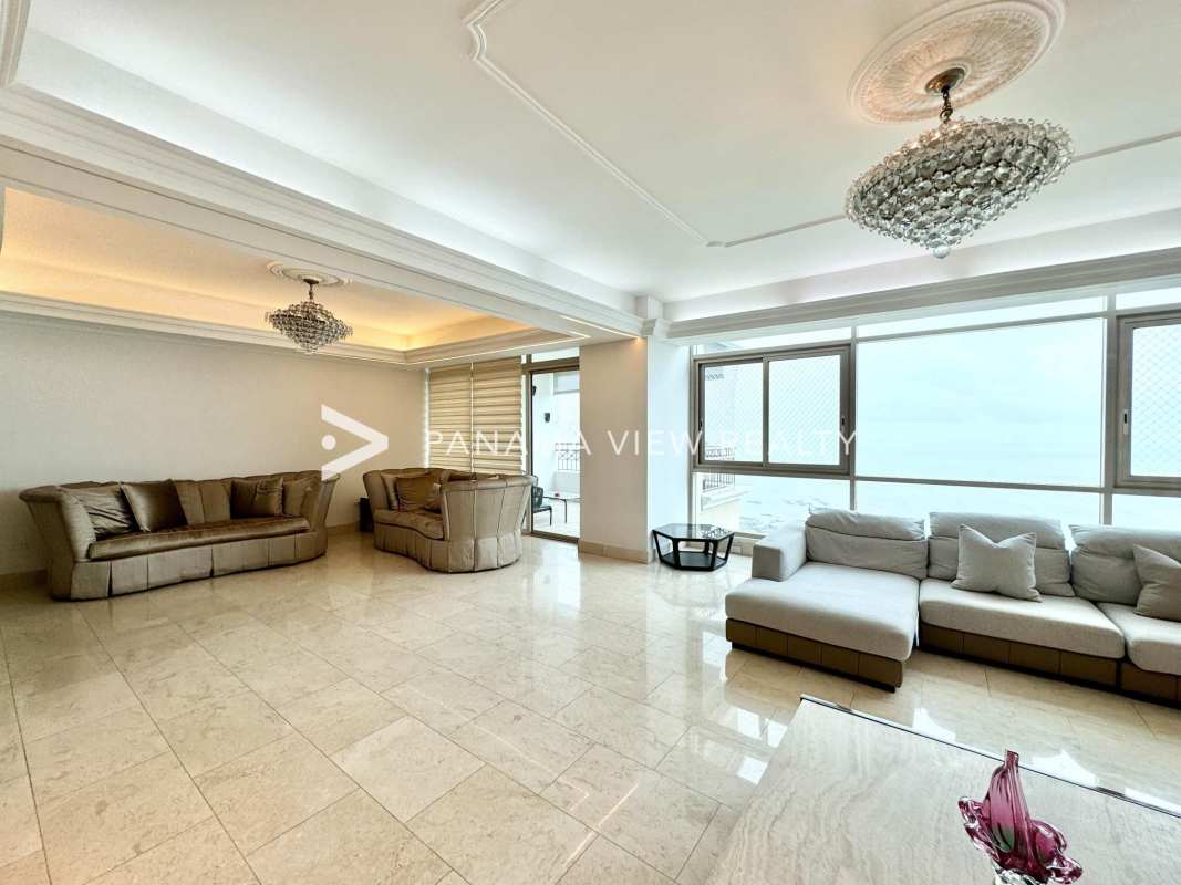 Luxury dining room with ocean view, marble floors, chandelier, Punta Pacifica Panama