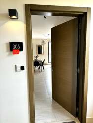 Private balcony overlooking green gardens and pools in PH River Valley Panama Pacifico