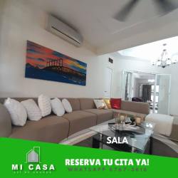 Elegant dining room with large table, wall mirror bright neutral tones Penonomé Panama