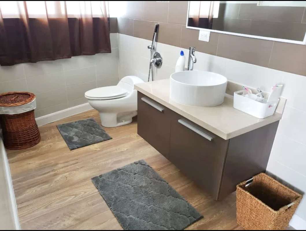 Rooftop infinity pool with glass railing and skyline view at PH San Francisco Joy Panama City