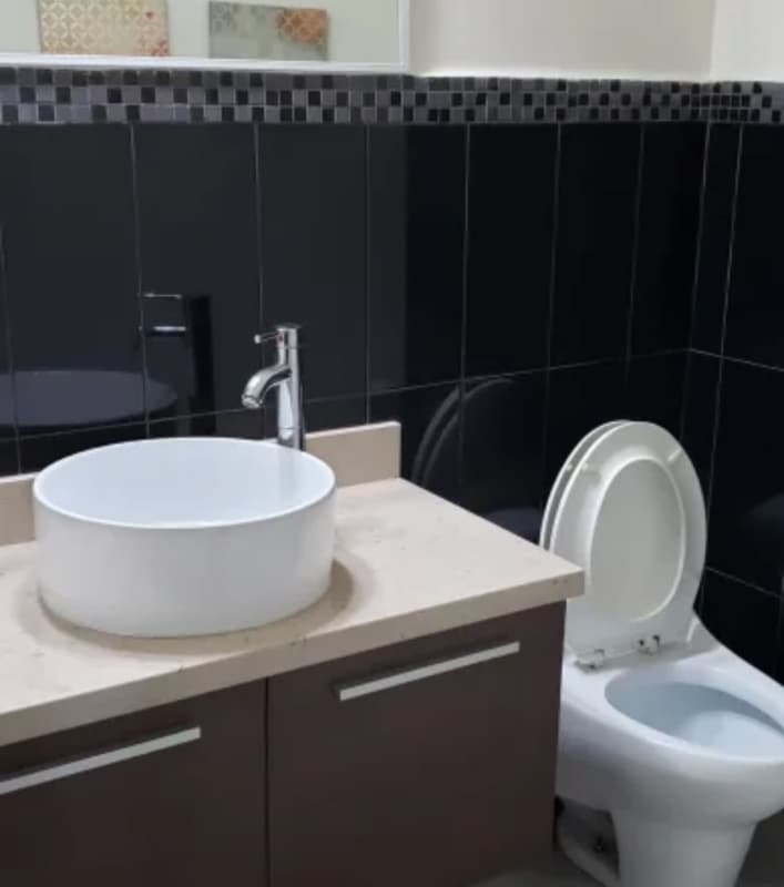 Elegant secondary bathroom with vessel sink, glass shower PH San Francisco Joy Panama