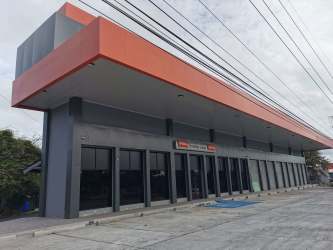 Glass front strip mall commercial space at Plaza Valencia along Interamericana Highway Coronado Panama