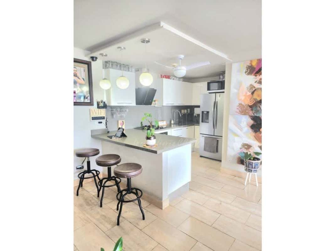 Spacious open plan living and dining room with balcony access in PH The Regent Costa del Este Panama