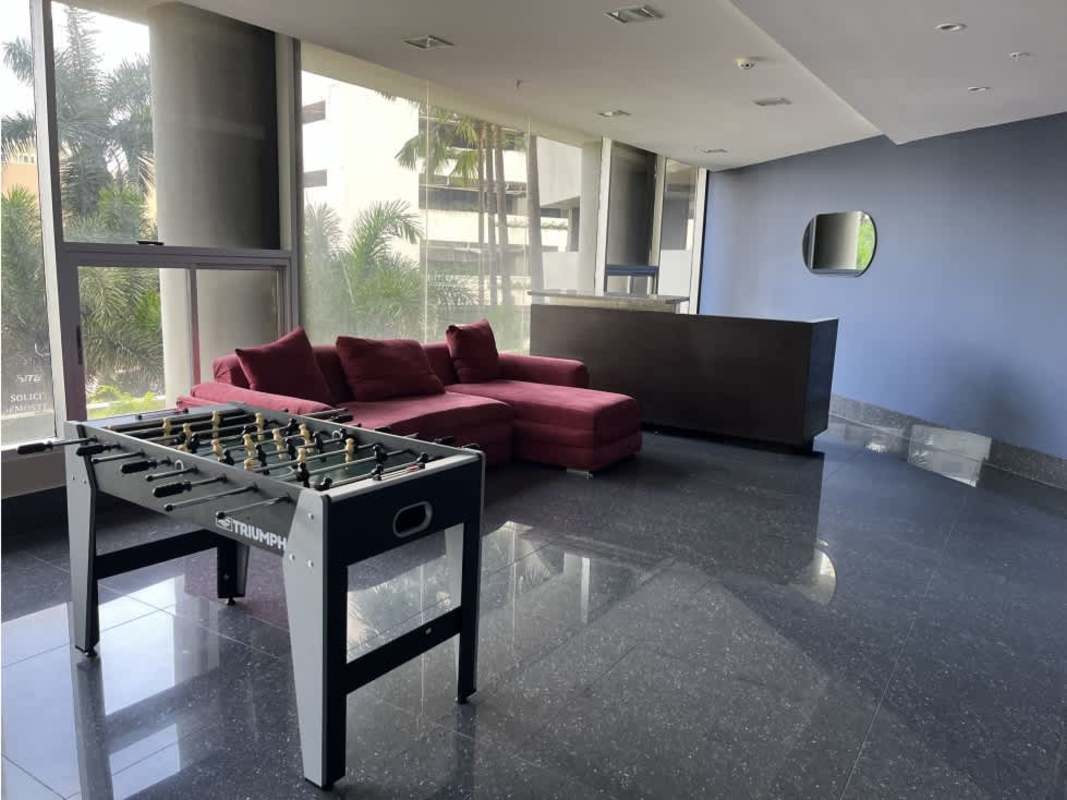 Elegant lobby with purple sofas, glass table, modern design at PH Luxor 100 El Cangrejo Panama