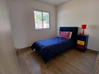 Bedroom featuring ceramic flooring and natural light in Panama house