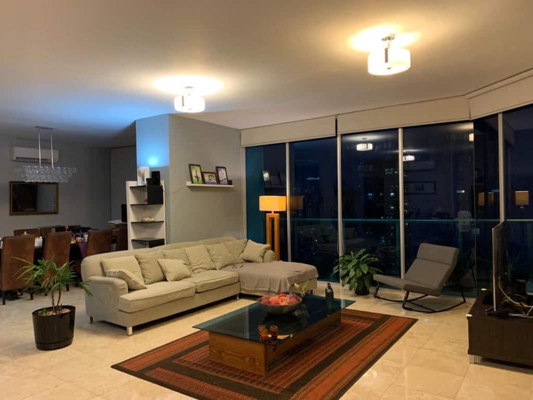 Living room with large windows city skyline view contemporary furniture in PH Sky Tower Panama