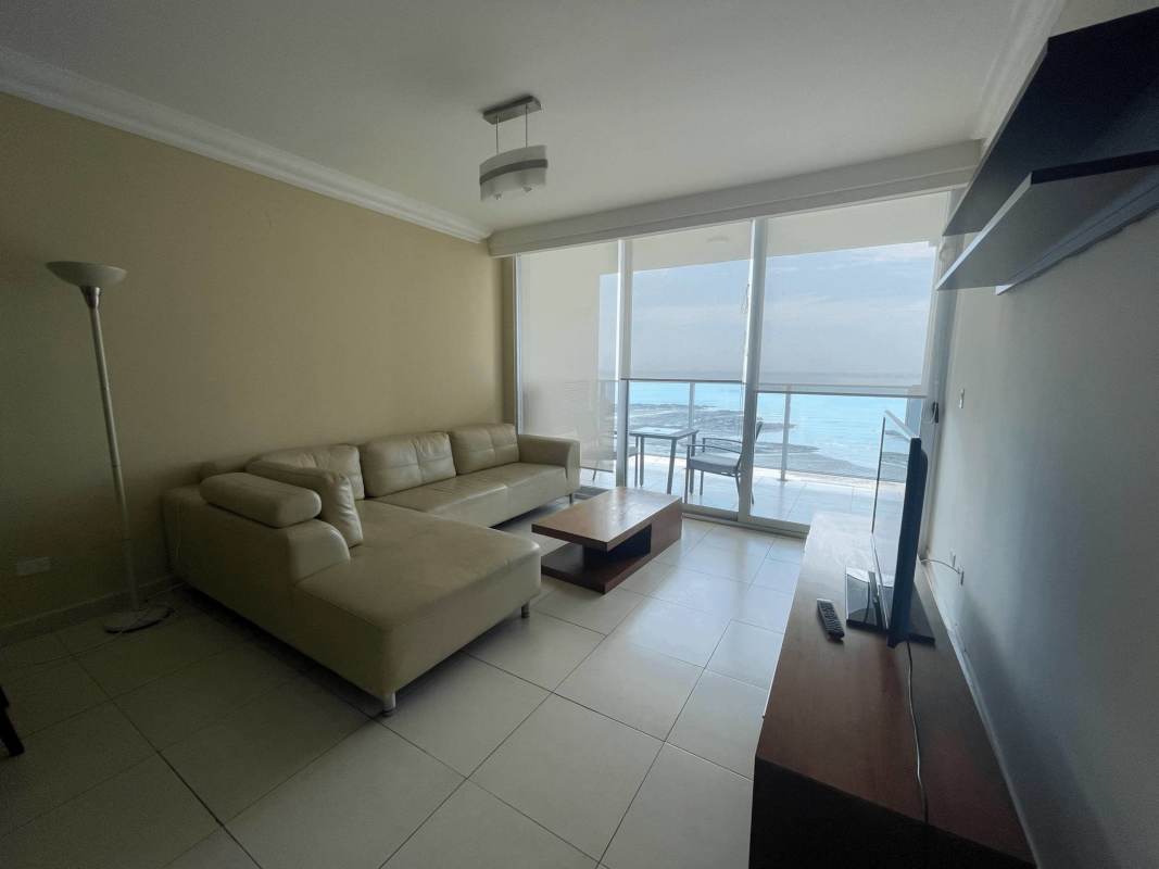 Bright living room with floor-to-ceiling windows and sea views in PH Waters Avenida Balboa Panama