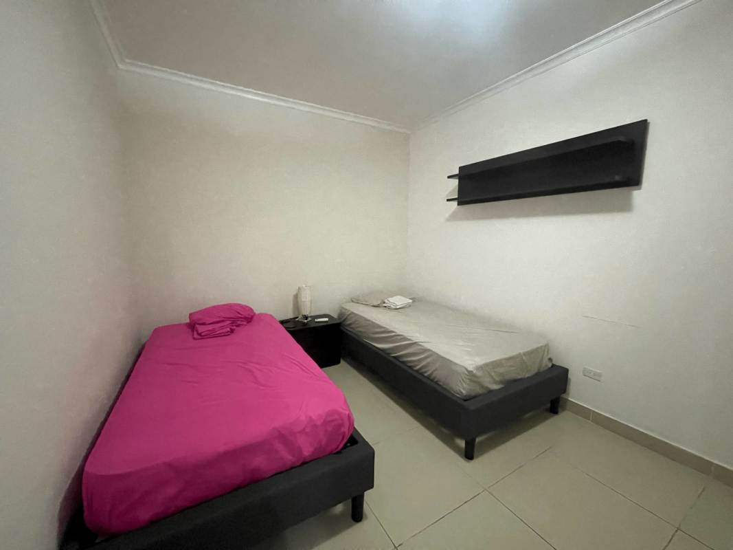 Contemporary kitchen with granite countertops and stainless appliances in PH Waters Panama City