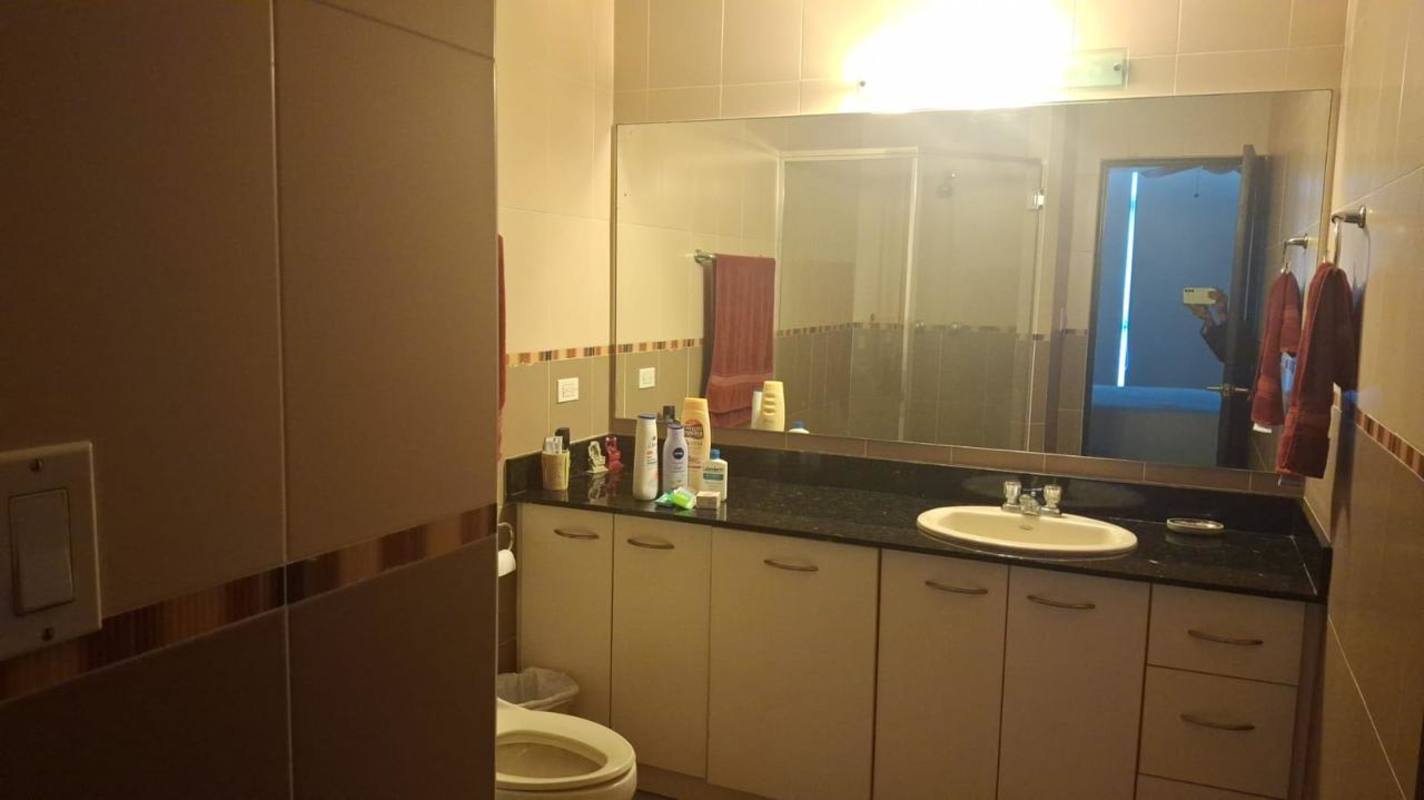 Bathroom with granite countertop, mirror, walk-in shower in PH Bayfront Tower Panama