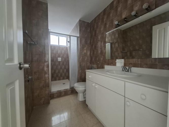 Spacious master suite with hardwood floors, walk-in closet, ensuite bath and balcony ocean views at PH Deluxe Residences Panama