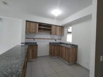 Townhouse exterior with balcony and covered parking Villas de La Campiña Vista Alegre Panama