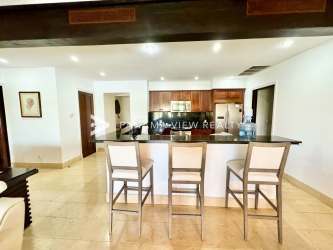 Bright modern kitchen with granite countertops, marble floors and breakfast bar in Bristol Villas Panama