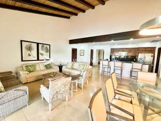 Open-plan bright living dining area with exposed wood beams and access to terrace in Bristol Villas Buenaventura