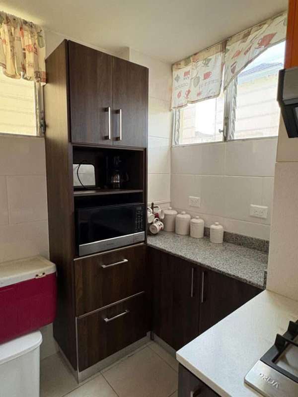Modern granite kitchen equipped with appliances in furnished apartment PH Altamira Residences Condado del Rey Panama