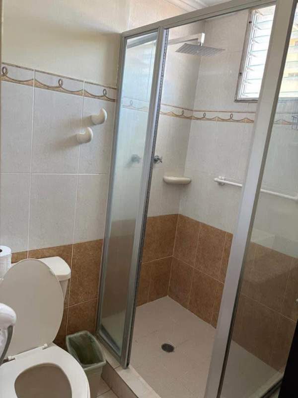 Second bathroom with ceramic tiles and walk-in shower PH Altamira Condado Panama