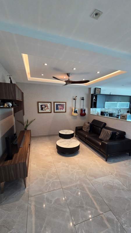 Large bright living room with marble floors, seating area, and modern décor in Costa Esmeralda Panama