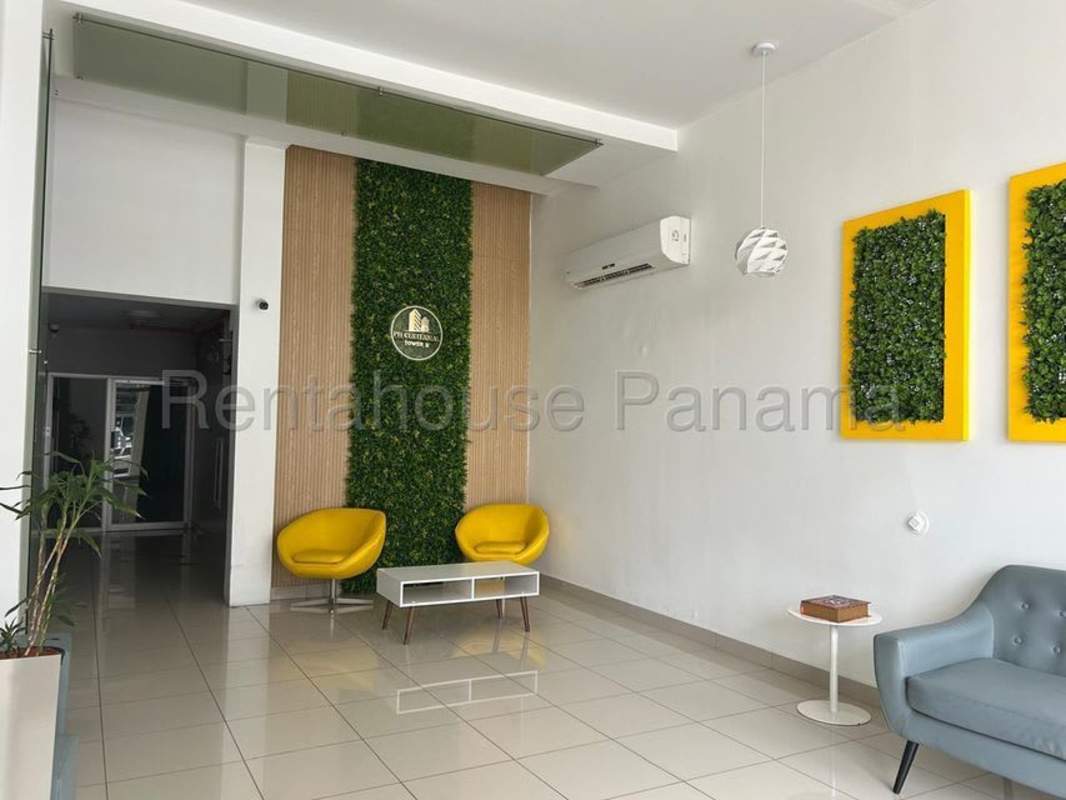 Bedroom with built-in closet, AC unit and window with city views in PH Centennial Panama