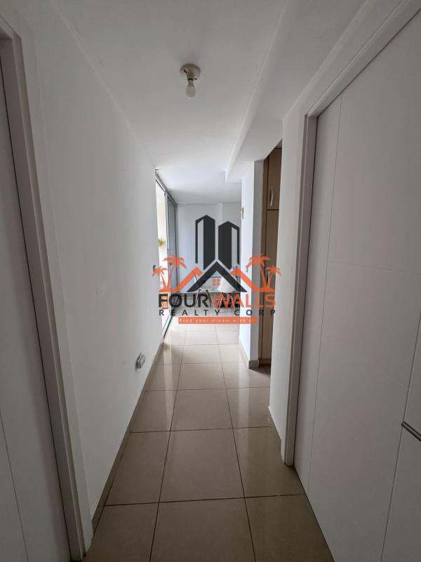 Bedroom featuring ceramic floors and built-in closet at PH Rokas Altos de Panamá