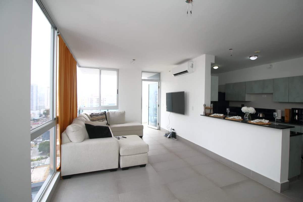Spacious open plan living room with tile flooring and balcony at Loma Vista Tower Panama City