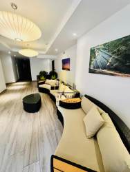 Living dining area with large windows and balcony access at Tucan Country Club Panama