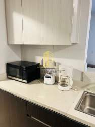 Spacious bedroom with large window overlooking nature at Tucan Country Club Panama