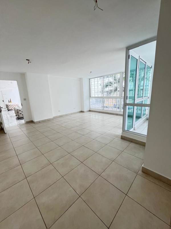 Living room with tile floor large windows balcony access El Mare 600 Panama