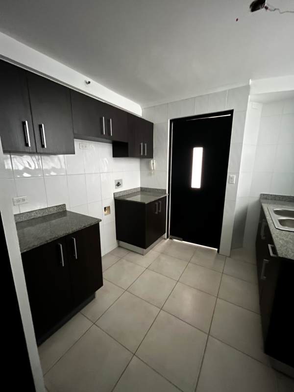 Modern kitchen with cabinets tiled walls window El Mare 600 Panama