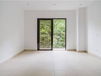 Spacious living room with balcony access and natural light Embassy Village Clayton Panama