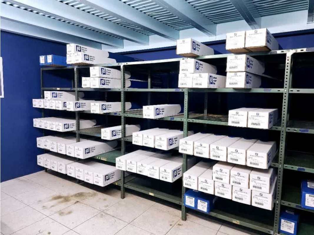 Back storage room with metal shelving and boxes in commercial unit for rent Panama City