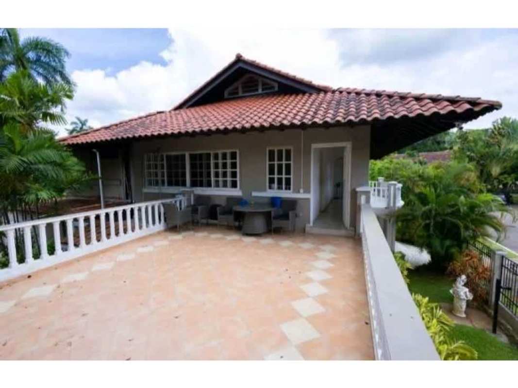 Expansive terrace with white columns and garden views at luxury diplomatic mansion Panama