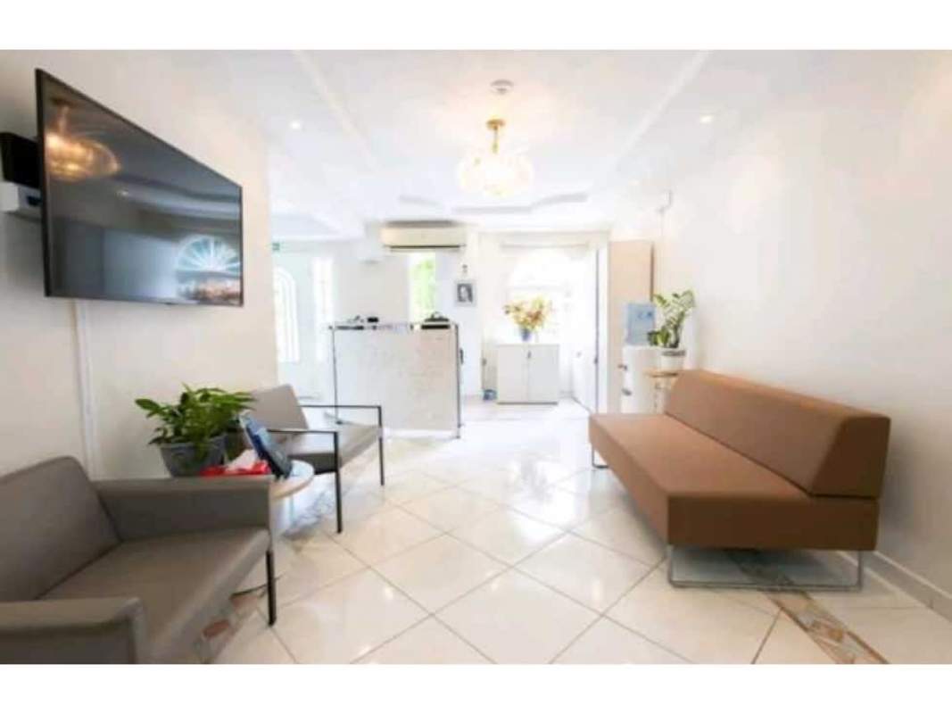 Bright reception waiting room with sofas, TV, and elegant decor in diplomatic mansion Panama