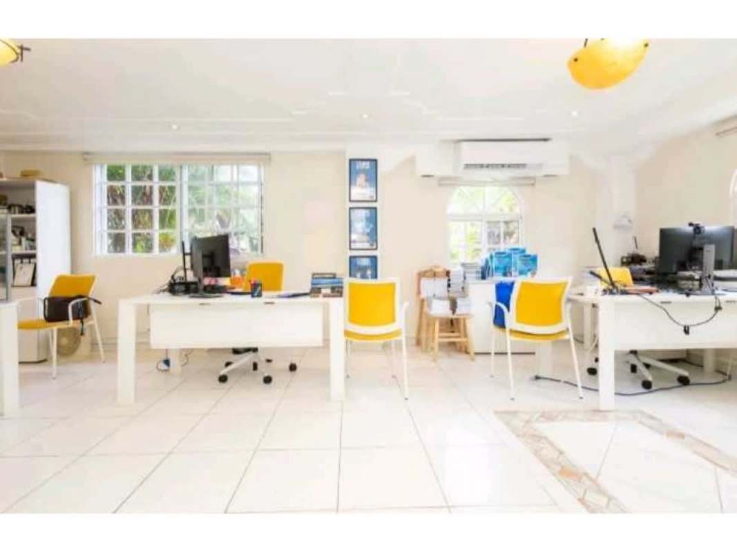 Colorful modern conference room with large table and tile flooring in Panama diplomatic mansion
