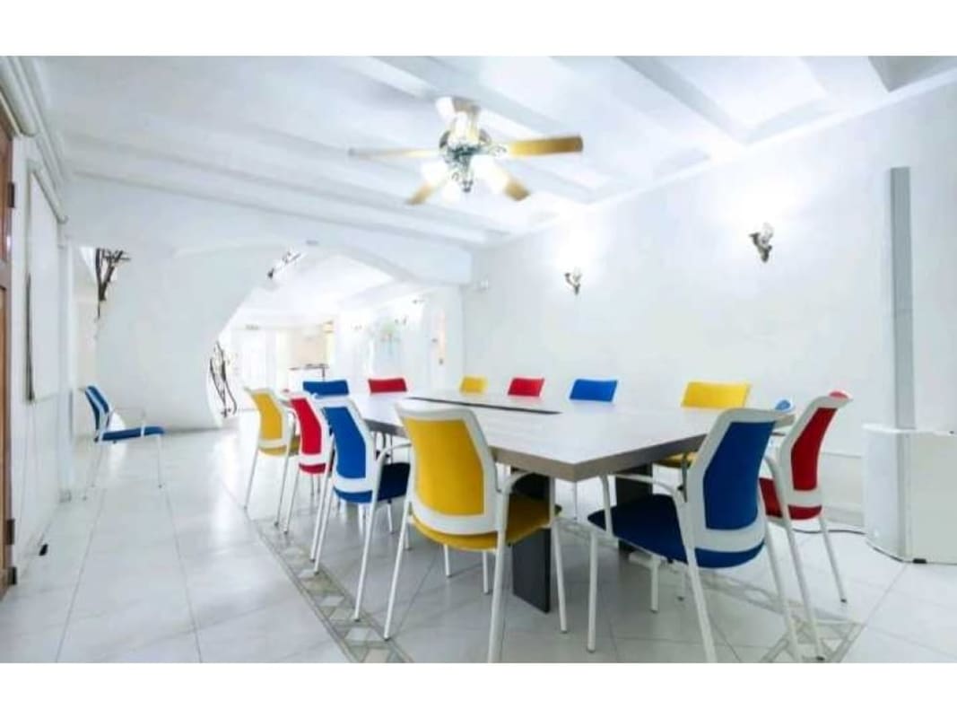 Bright modern office with large windows and tiled floors in Albrook mansion