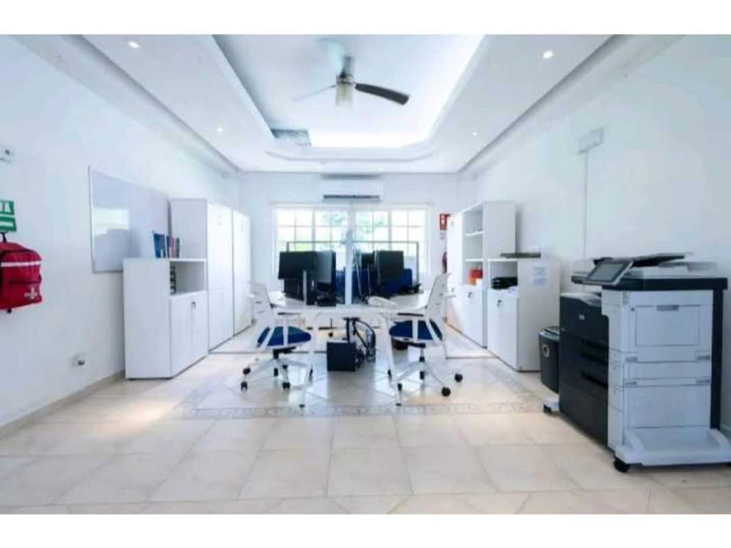 Well-lit minimalist office with large windows and AC in embassy mansion Panama